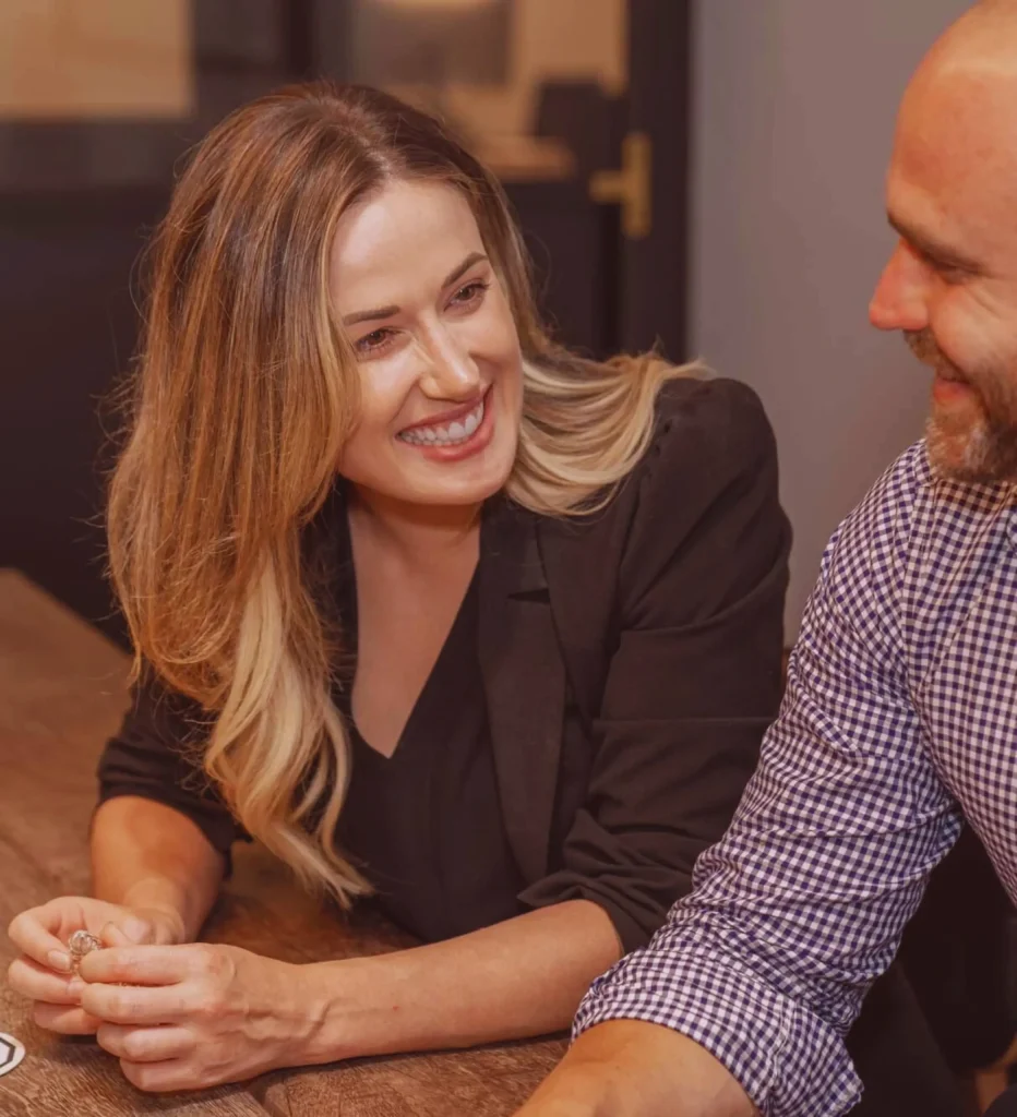 Two people meeting and shaking hands in a workspace