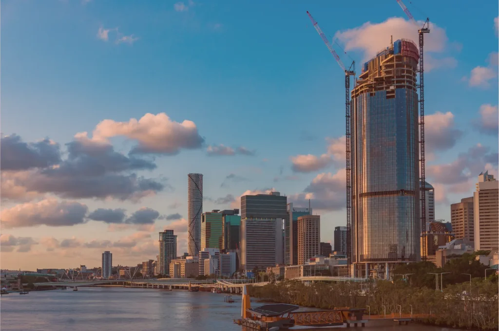 Construction and city skyline at dusk